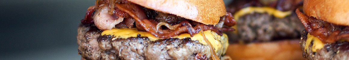 Eating Burger Fast Food at Tam's Burgers restaurant in Long Beach, CA.